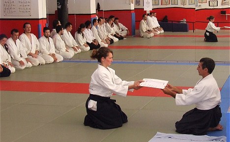 A moment during the ceremony of awarding Dan Aikikai degrees